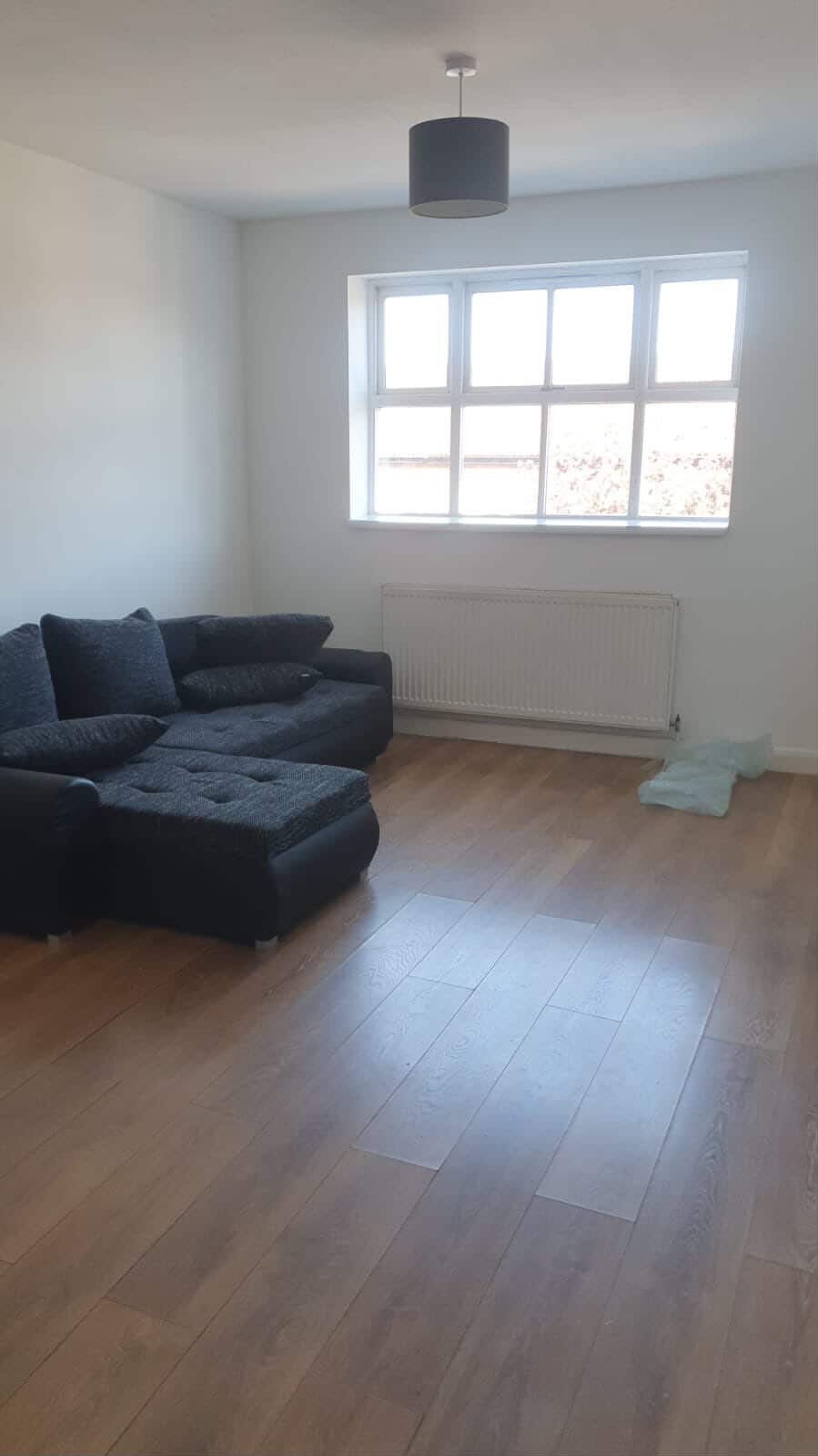 Living room before a move-in or move-out cleaning refresh.